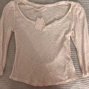New with tags: Free People cream blouse, size large poshmark